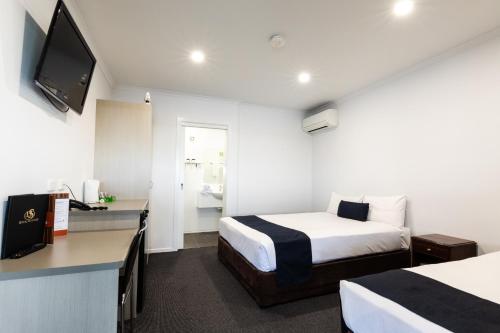 Cama o camas de una habitación en Hotel Settlers