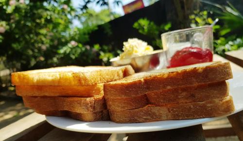 a plate with slices of bread on a table at Breeze Guest House in Trincomalee