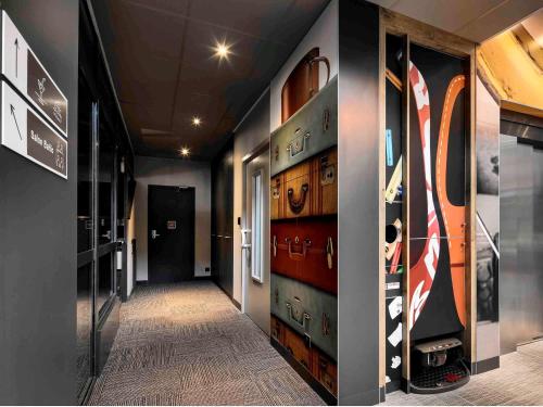 a hallway with a bunch of drawers in a room at ibis Site du Futuroscope in Chasseneuil-du-Poitou