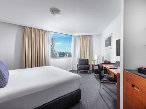 Säng eller sängar i ett rum på The Sebel Brisbane