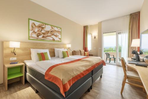 Postel nebo postele na pokoji v ubytování Hotel Hochsauerland by Center Parcs