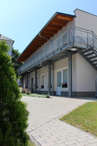 a building with a staircase on the side of it at Pension Am Ziegelwall in Bautzen