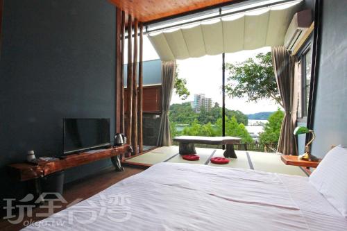 Voodi või voodid majutusasutuse Yue Lake Backpackers toas
