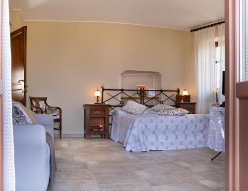 Ένα ή περισσότερα κρεβάτια σε δωμάτιο στο Il Borgo B&B