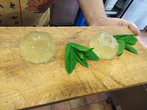 two rolls on a cutting board with green leaves at Azienda Agrituristica Risveglio Naturale in Varese Ligure