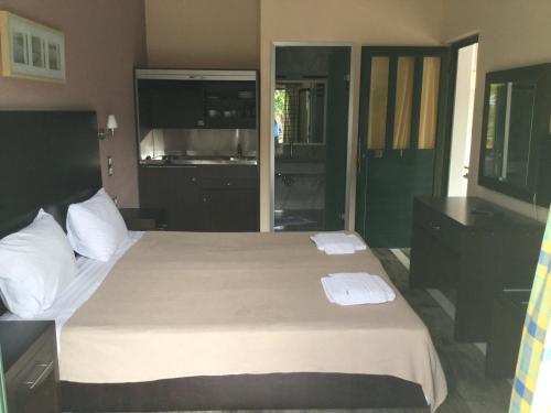 Ένα ή περισσότερα κρεβάτια σε δωμάτιο στο Villa Vasso