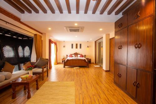 a living room with a couch and a bed at Nivas Boutique Home in Kathmandu