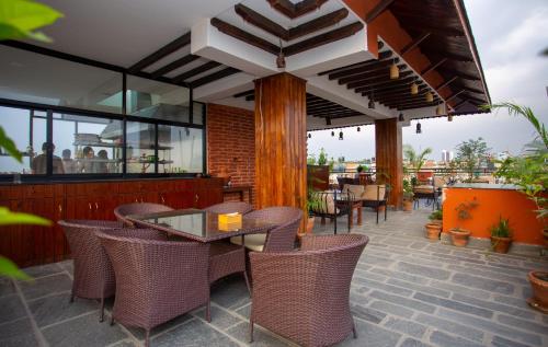 a patio with a table and chairs on a patio at Nivas Boutique Home in Kathmandu