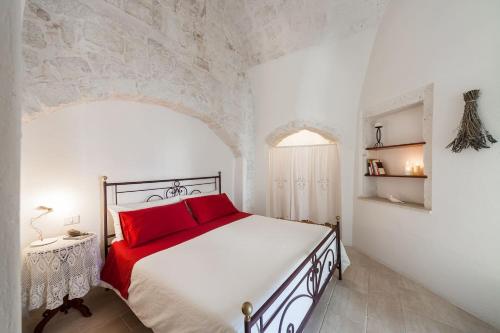 Postel nebo postele na pokoji v ubytování Cuore di Pietra - centro storico Ostuni