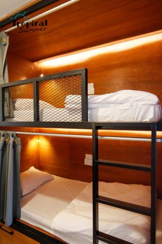 Postel nebo postele na pokoji v ubytování Tropical Summer Hostel