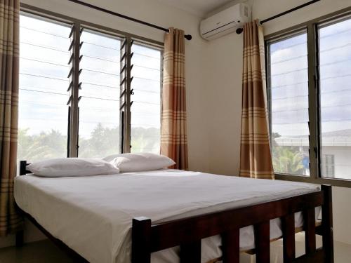 Postel nebo postele na pokoji v ubytování FIJI HOME Apartment Hotel