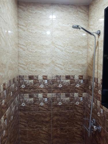 a bathroom with a shower with a glass door at Apartment in Tbilisi in Tbilisi City