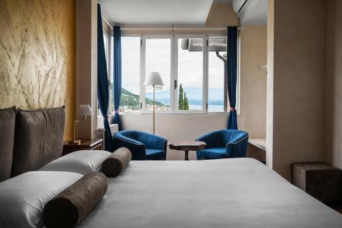 Ένα ή περισσότερα κρεβάτια σε δωμάτιο στο La Villa