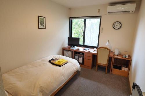Katil atau katil-katil dalam bilik di Yakushima Green Hotel