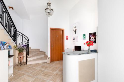 a hallway with a staircase and a stair case at Sorrento Marida Rooms in Sorrento