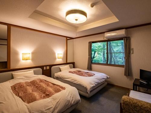 Cama o camas de una habitación en Hakone Onsen Sanso Nakamura