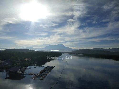 a view of a large body of water with a mountain at Homestay Bah! in Kota Kinabalu