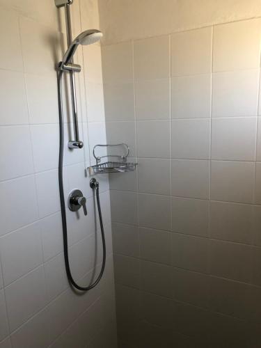 a shower with a shower head in a bathroom at Hotel Marlisa Pier in Lido di Jesolo