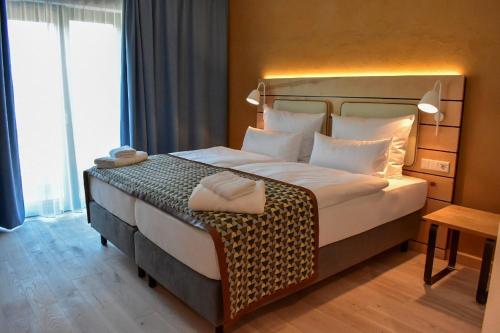 Walhalla Hotel Regensburg Hoeferer 4 Sterne Superiorにあるベッド