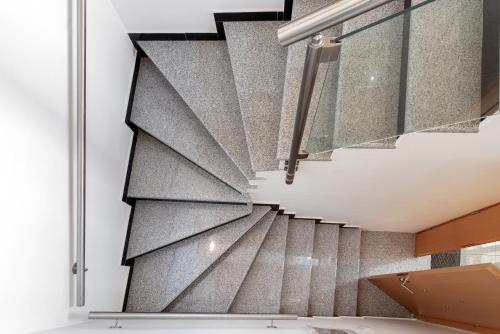 a wall mural of a staircase in a house at Elegant Living in Argostoli