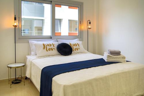 a bedroom with a bed with a pillow on it at Phaedrus Living: City Centre Luxury Flat Esperidon 201 in Nicosia