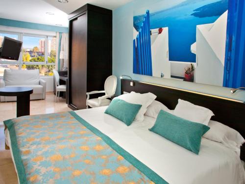 Postel nebo postele na pokoji v ubytování Hotel Villa del Mar