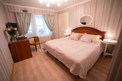 Postel nebo postele na pokoji v ubytování Holiday Village Kukkapää