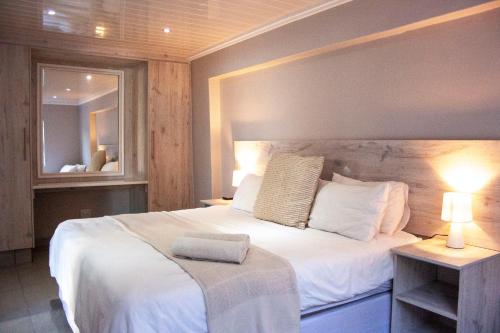 Ένα ή περισσότερα κρεβάτια σε δωμάτιο στο Kelzane Self-Catering