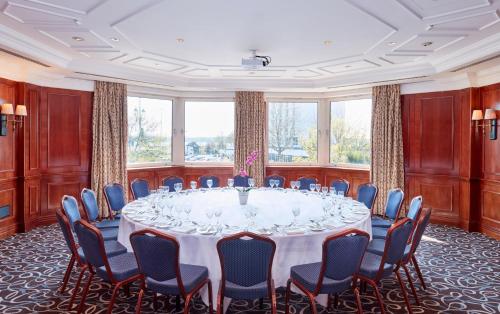 a large room with a large table and chairs at Leonardo Royal Southampton Grand Harbour in Southampton