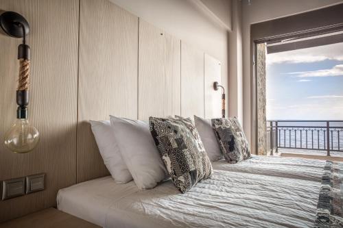 Un ou plusieurs lits dans un hébergement de l'établissement Royalty Suites Seaside
