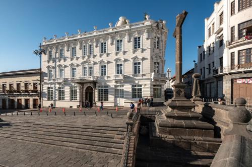 a large white building with stairs in front of it at Hotel Casa Gangotena in Quito
