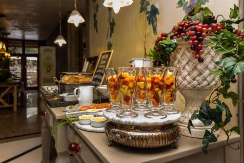 a buffet with glasses of oranges on a table at Hagios House in Pretoria