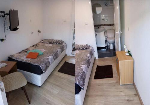 a small room with a bed and a bathroom at Pension Haus Baron 1 Neckarau in Mannheim
