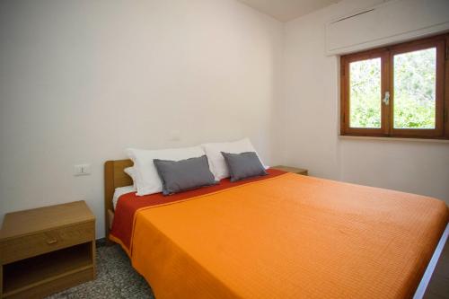 Ένα ή περισσότερα κρεβάτια σε δωμάτιο στο Residence le Mimose