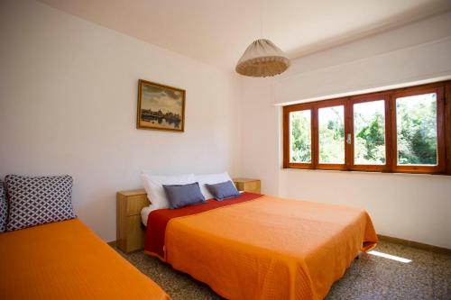 Un pat sau paturi într-o cameră la Residence le Mimose