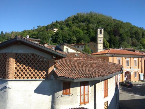 a view of a town with a clock tower on a hill at GrigioPerla in Tavernerio