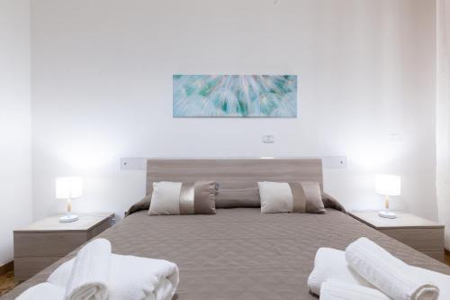 Postel nebo postele na pokoji v ubytování Lupomonaco Rooms