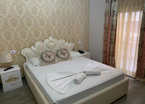 Ένα ή περισσότερα κρεβάτια σε δωμάτιο στο Hotel Antalya - Beach Durres
