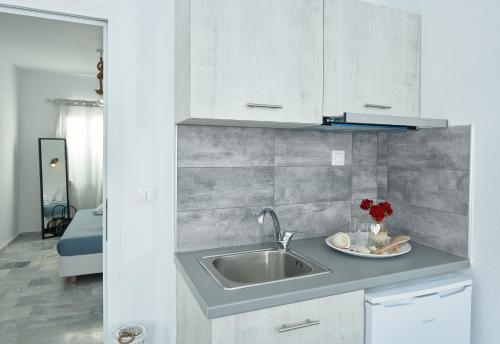 a kitchen with a sink and a counter top at Lefki villa in Polykhrono