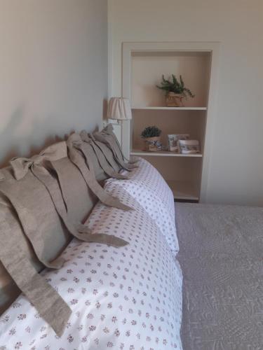 a bedroom with a bed with a blanket on it at Agriturismo Fonteregia in Montecatini Terme