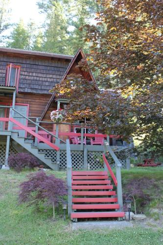 a house with a staircase leading to a house at Sunny Bluffs Chalets in Kaslo