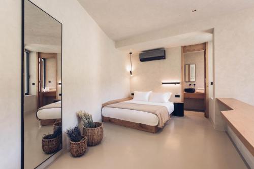 A bed or beds in a room at Monastery Estate Retreat