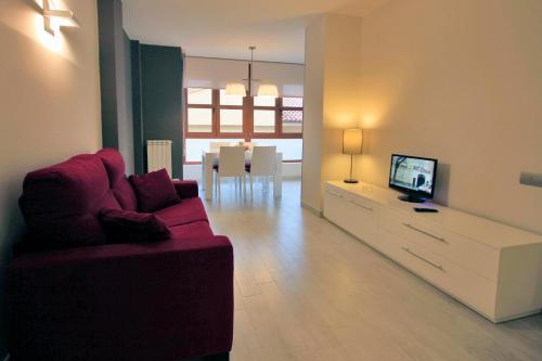 Μια τηλεόραση ή/και κέντρο ψυχαγωγίας στο Lagaya Apartaments & Spa