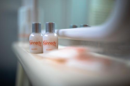 two bottles of emergency shampoo sitting on a counter at Hotel Kennedy in Lido di Jesolo