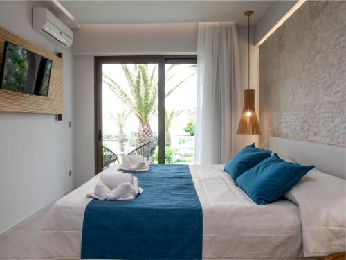 Ένα ή περισσότερα κρεβάτια σε δωμάτιο στο Marinos Beach Hotel