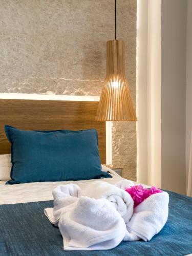 Ένα ή περισσότερα κρεβάτια σε δωμάτιο στο Marinos Beach Hotel