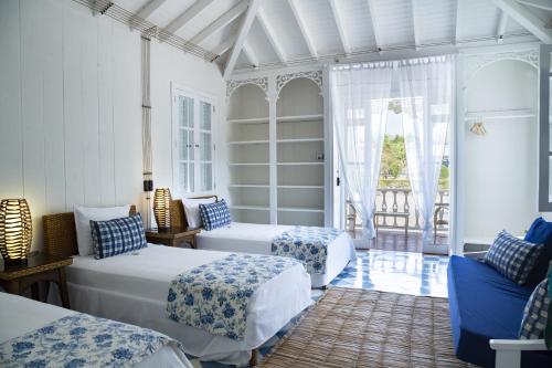Ліжко або ліжка в номері Hotel Agua Azul Beach Resort