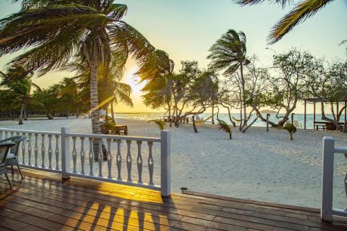 a view of the beach from a wooden deck at Hotel Agua Azul Beach Resort in Baru