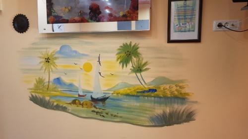 een schilderij van een boot aan de muur bij Hotel-Hostel Mignon Mamaia -private rooms with free parking in Mamaia