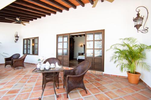 a living room with a table and chairs at BellView Hotel Boutique in Puerto Vallarta